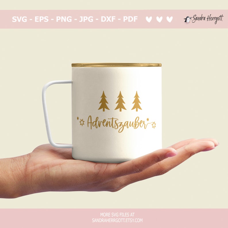 May include: A cream-coloured mug with a gold rim and white handle, decorated with gold fir trees and the word "Adventszauber". The mug is held in a hand. The image also includes the text "SVG - EPS - PNG - JPG - DXF - PDF" and "MORE SVG FILES AT SANDRAHERRGOTT.ETSY.COM".