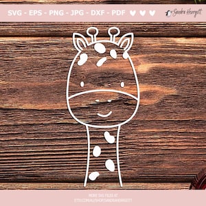 May include: A white outline drawing of a giraffe with a spotted pattern on a brown wooden background. The giraffe has a simple, smiling face.