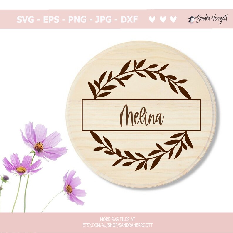 May include: A round wooden sign with a brown leafy wreath and a rectangular nameplate that says "Melina".