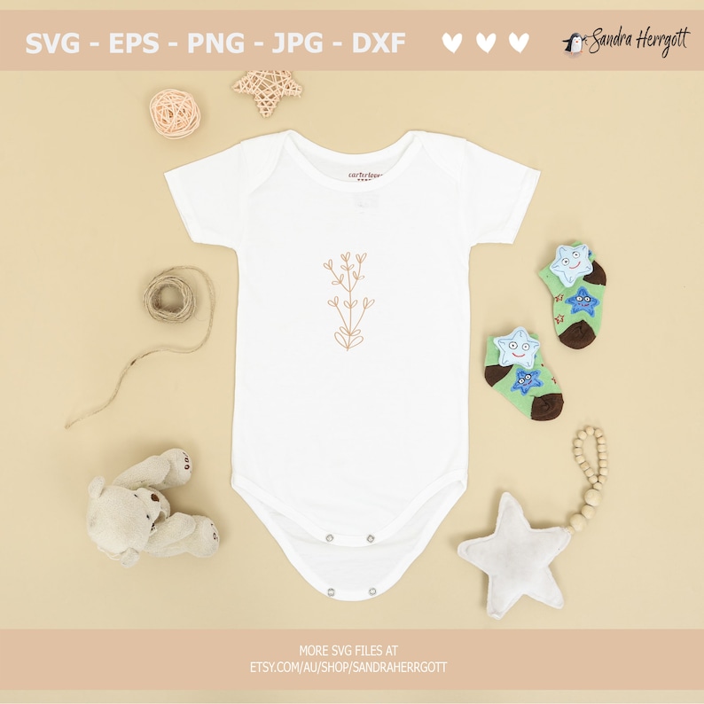 May include: A white baby onesie with a simple line drawing of a plant with leaves and flowers in brown. The onesie is surrounded by various baby items, including a stuffed bear, a star-shaped rattle, and a pair of socks with star designs.