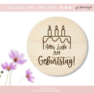 May include: A round wooden sign with a brown outline of a birthday cake with candles and the text "Alles Liebe zum Geburtstag!"