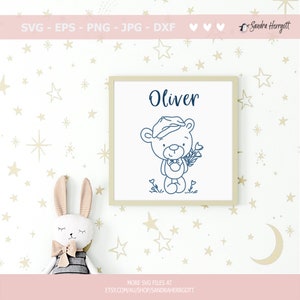 May include: A printable design featuring a cute cartoon bear wearing a hat and holding flowers. The design includes the name "Oliver" and is perfect for a nursery or child's room.