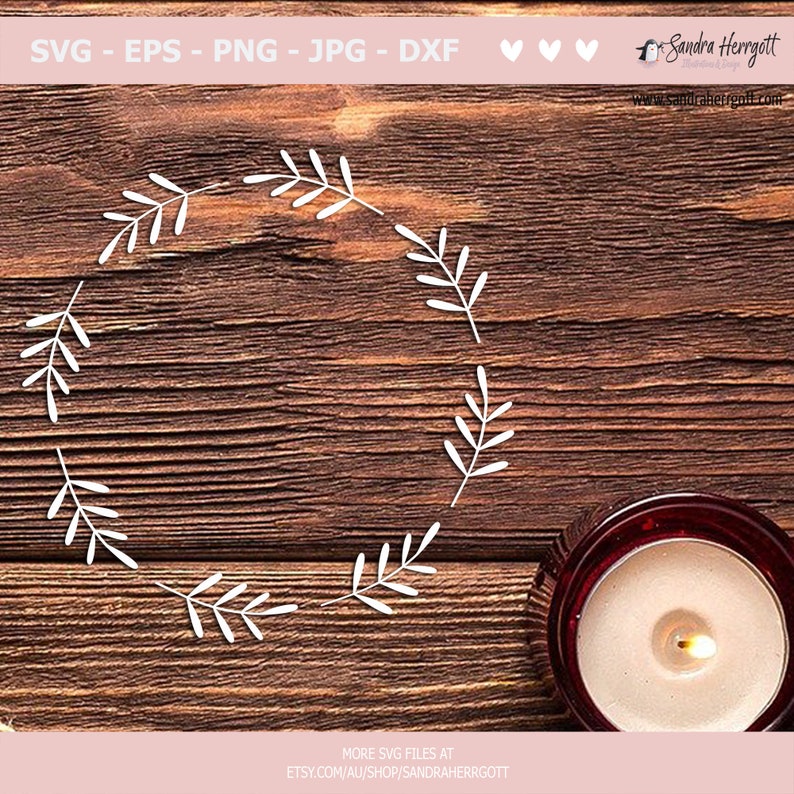 May include: A white wreath made of simple branches on a brown wooden background. A lit candle in a red glass jar is in the bottom right corner of the image.