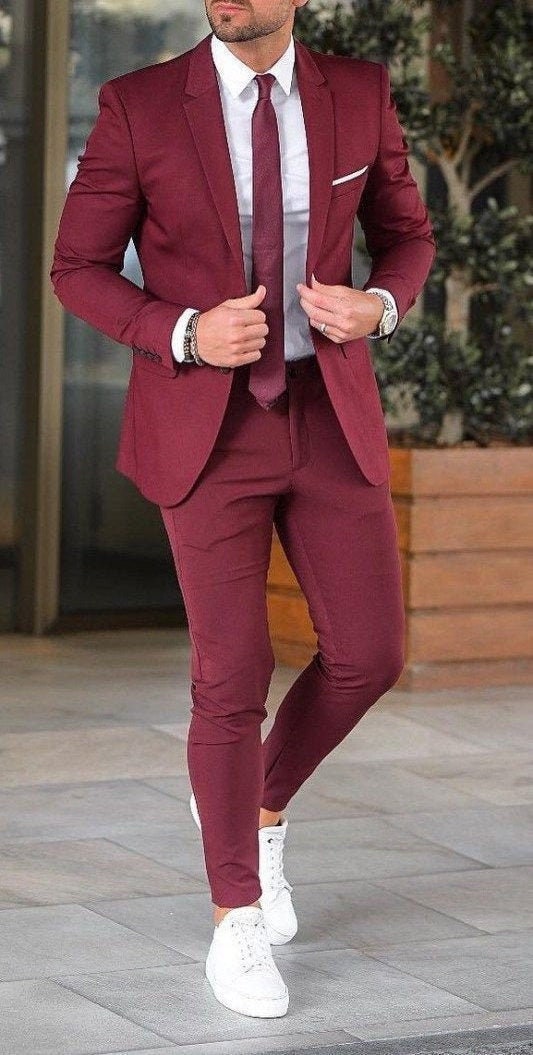 maroon coat and white pants
