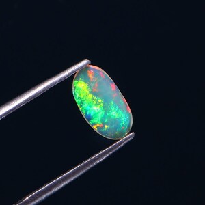 Ethiopian Welo Opal Slice: Faceted Gemstone, October Birthstone (0.65 Carat, 10.2x6.5x1.7MM)