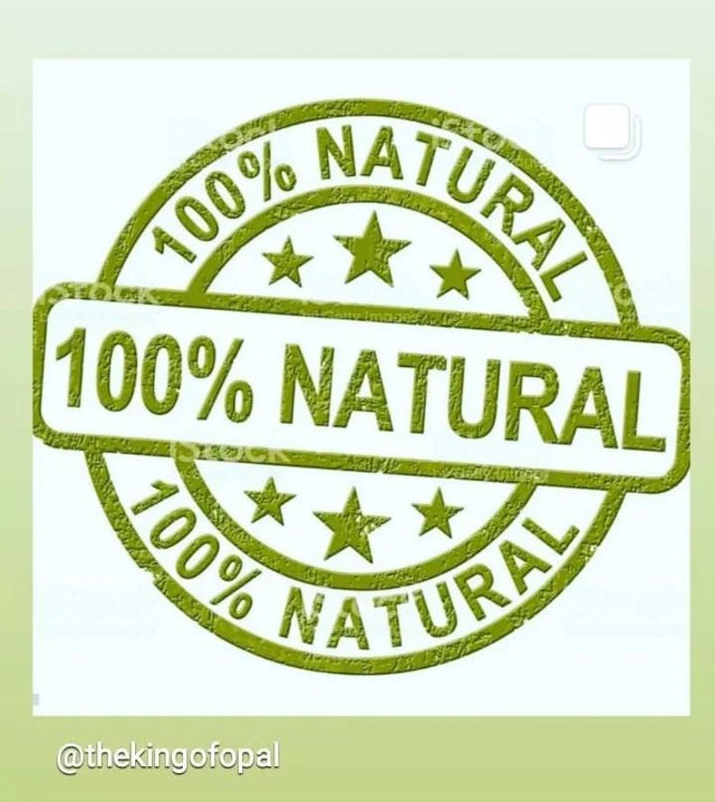 May include: A green stamp with the words "100% NATURAL" in a circular design. The text is repeated around the border and in a rectangular box in the center. Three stars are placed between the words. The background is a light green.
