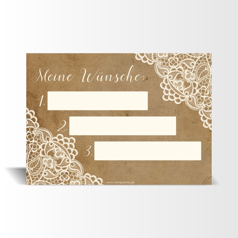 May include: A brown card with white lace trim and the text "Meine W&uuml;nsche" with three blank lines numbered 1, 2, and 3. The bottom of the card has the website "www.stempelkontor.de".