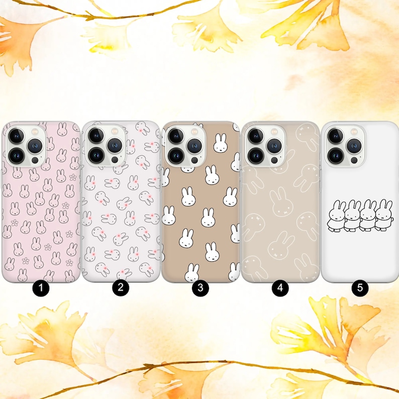 May include: Five different phone cases with a bunny rabbit pattern. The cases are all clear and show the phone's camera lens. The bunny rabbit pattern is in pink, white, and brown. The cases are numbered 1 through 5.
