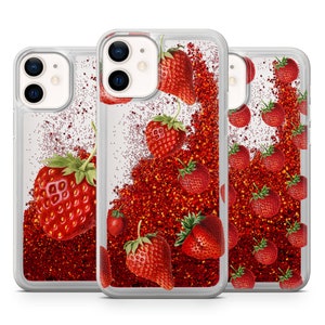 May include: Clear phone cases with a vibrant design featuring red glitter and realistic strawberries. The cases have a liquid glitter effect, with strawberries seemingly floating within the red glitter. The cases are designed to fit a smartphone.