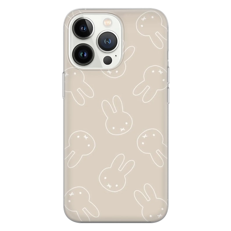 May include: A clear phone case with a beige background and a white bunny rabbit pattern. The case is designed for an iPhone.