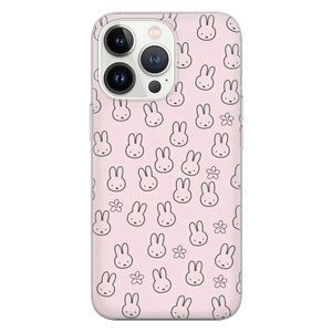 May include: A clear phone case with a pink background and a repeating pattern of black bunny rabbits and white flowers.