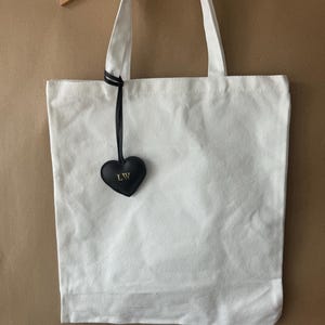 Personalised heart shaped bag charm