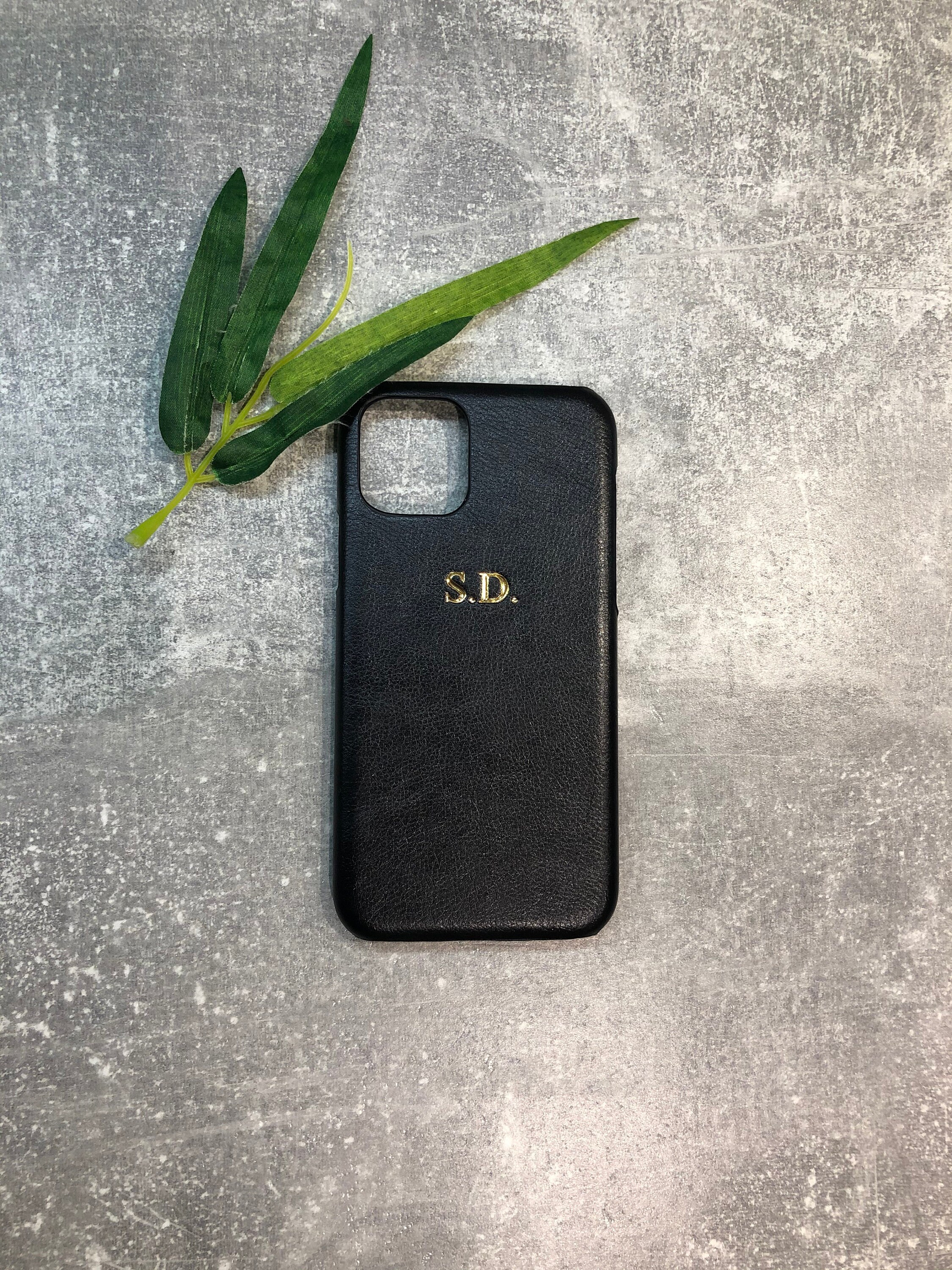 A blue IPhone 12 PRO PU leather phone case with a name in the front