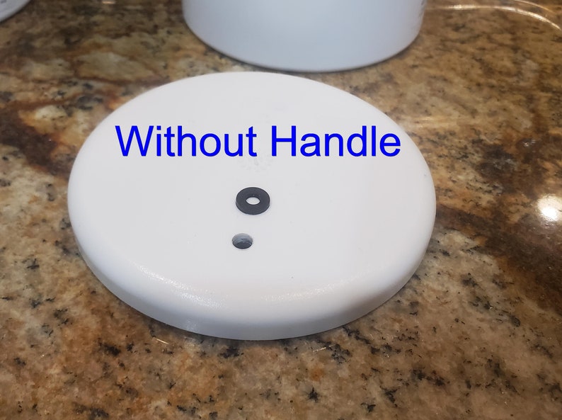 May include: White ceramic lid with a black rubber seal and a small hole in the center. The text "Without Handle" is written on the lid.