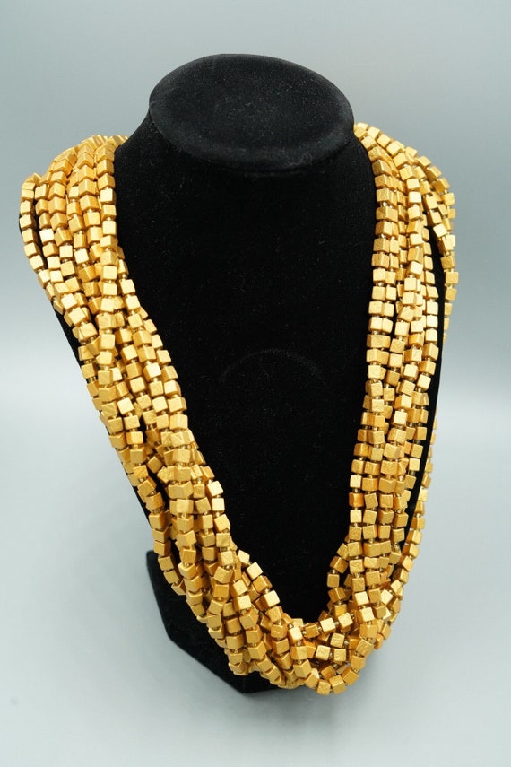 Festive gold tone necklace