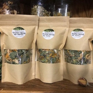 May include: Three brown paper bags filled with dried herbs labelled "Chicken Nesting Box Herbs".