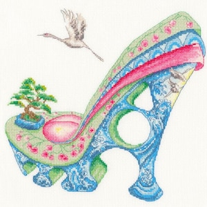 May include: A blue and green high-heeled shoe with a pink ribbon and floral details. A small bonsai tree is on the side of the shoe.
