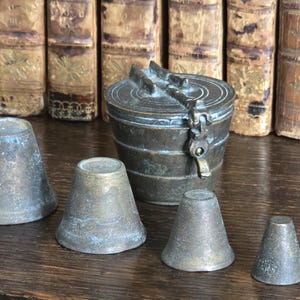 A set of Nuremberg Brass Cup Weights, Stacking Weights
