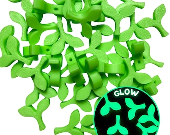 May include: Vibrant green, leaf-shaped connectors. The image includes a close-up of a single connector measuring 19 mm in height and 22 mm in width, along with a small ring. A circular inset shows the connectors glowing. The text "GLOW" is visible.