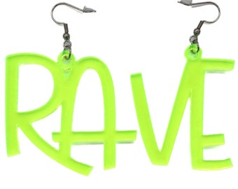 May include: Neon green acrylic earrings shaped like the word "RAVE".