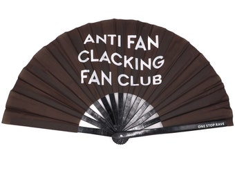 May include: A black folding fan with white text that reads "ANTI FAN CLACKING FAN CLUB" and the words "ONE STOP RAVE" on the bottom.