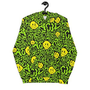 May include: A black and green hoodie with a psychedelic pattern of melting smiley faces and the word "acid" repeated throughout.