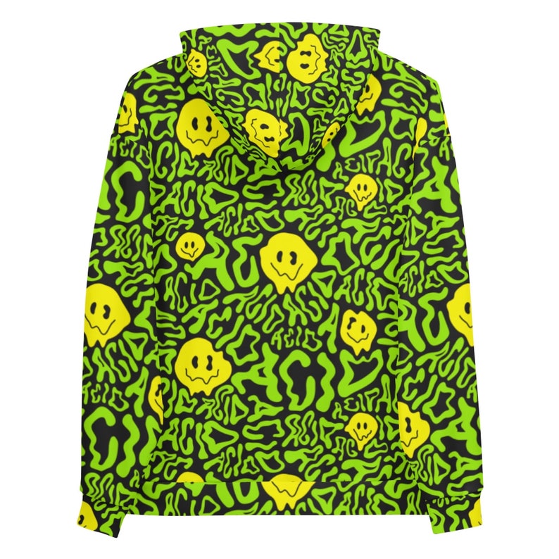 May include: A black hoodie with a green and yellow pattern. The pattern features a repeating design of a smiley face with the word "acid" written in a wavy font.