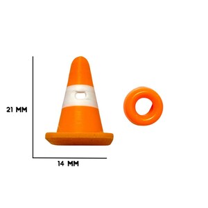 May include: Orange and white miniature traffic cone and a matching orange ring. The cone is 21 mm tall and 14 mm wide. The image includes the text "ONE STOP RAVE".