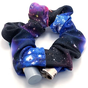May include: A galaxy print scrunchie with a lighter and a small tube tucked inside.