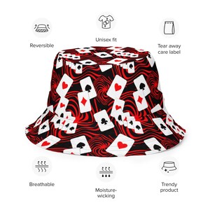 May include: A black bucket hat with a red and white playing card pattern. The hat has a wide brim and a flat crown.