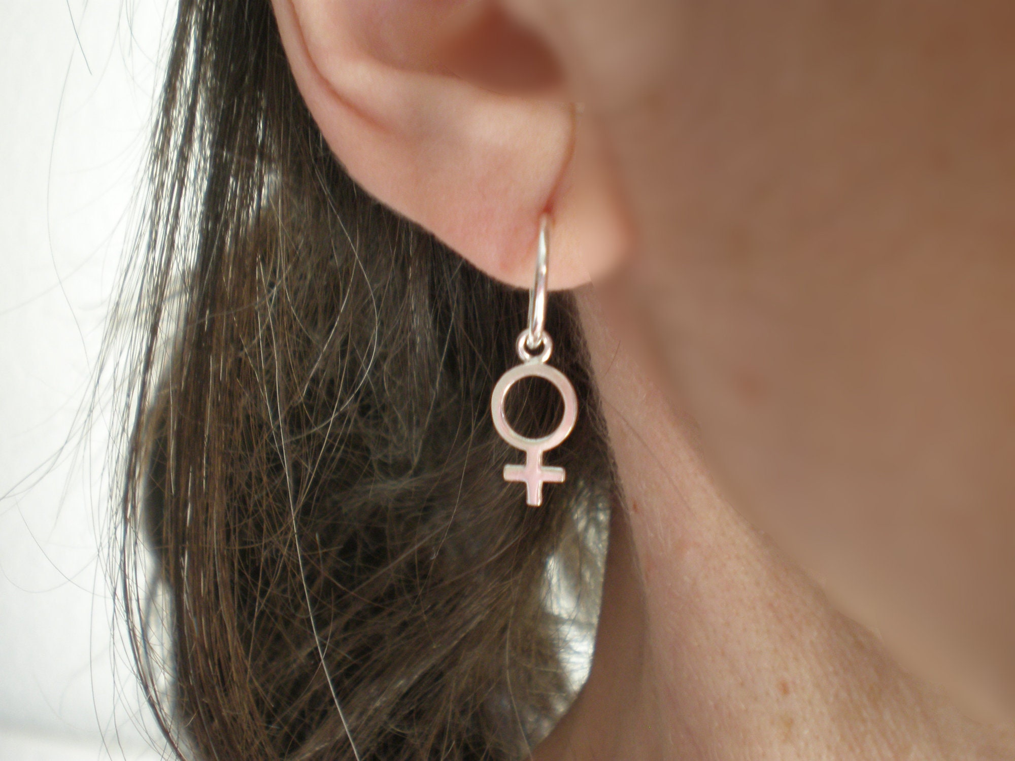 Woman symbol best sale earrings