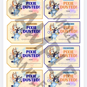 May include: A sheet of gift tags featuring the phrase "YOU HAVE BEEN PIXIE DUSTED!" and cartoon character illustrations. The tags are in shades of blue, orange, and yellow, with a space to write "FROM:"