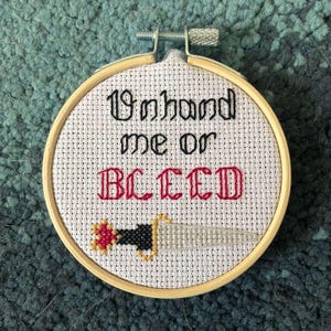 Our Flag Means Death finished cross stitch - Unhand Me or Bleed