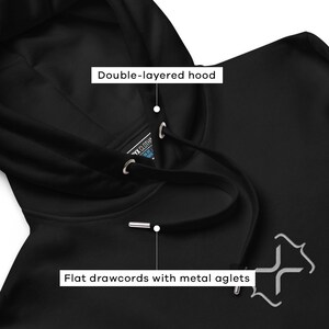 May include: Black hooded sweatshirt with a double-layered hood and flat drawcords with metal aglets. The sweatshirt has a small, gray, stylized logo on the front.