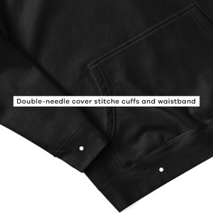 May include: Black hooded sweatshirt with a pouch pocket and double-needle cover stitched cuffs and waistband.