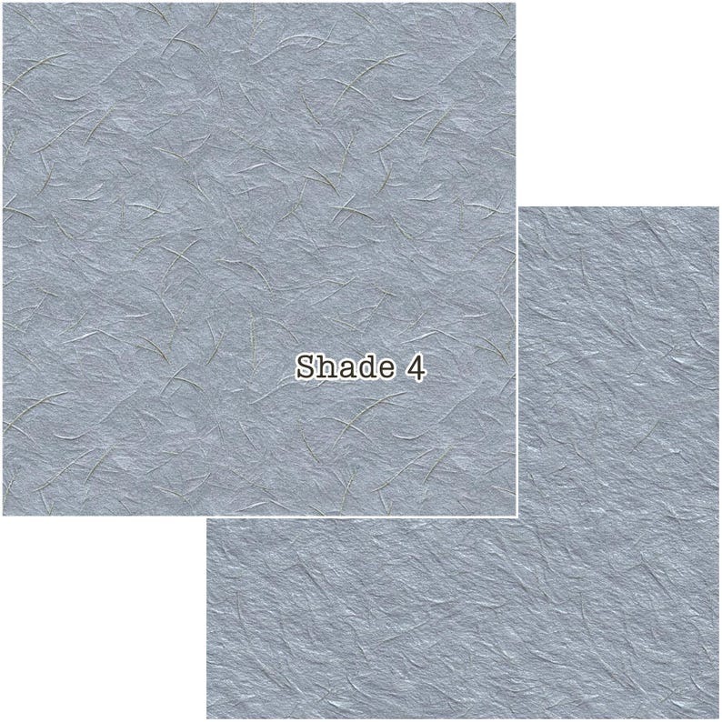 Puede incluir: Papel azul claro texturizado con finas fibras verdes. La imagen muestra tres hojas rectangulares de diferentes tama&ntilde;os, con el texto "Shade 4" en la m&aacute;s grande. El papel tiene una textura arrugada.
