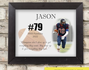 May include: A black framed print displaying a football player in a red and blue uniform, with the name "JASON" and the number "79." The print includes a football graphic, team name "MHS Panthers 2022," and a motivational quote. The frame is black.