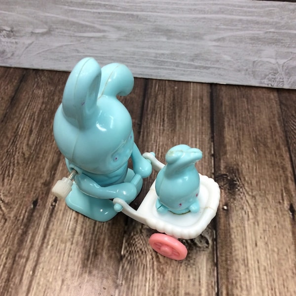 Wind up toy Bunny with baby bunny in stroller , Easter Wind up Mommy pushing Baby Bunny in Stroller circa 1970’s wind up toy
