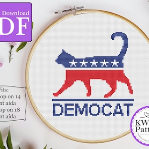 May include: Cross stitch pattern for a cat silhouette with an American flag design and the word "DEMOCAT". The pattern fits an 8-inch hoop on 14 count Aida or a 6-inch hoop on 18 count Aida.
