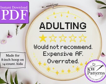 Puede incluir: Un patrón de punto de cruz para un aro de 20 cm de diámetro con el texto "ADULTING" con una calificación de una estrella y el texto "Would not recommend. Expensive AF. Overrated."