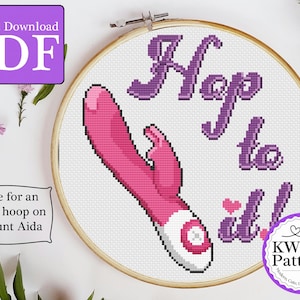 May include: Cross-stitch pattern in a wooden hoop featuring a pink and white vibrator design with the words "Hop to it!" in purple. The pattern is designed for an 8-inch hoop and is available as an instant PDF download.