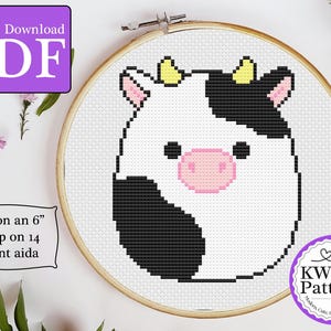 May include: A cross stitch pattern of a cute cartoon cow with black and white spots and a pink nose. The pattern is designed to fit on a 6 inch hoop and uses 14 count Aida cloth. The pattern is available as an instant download PDF.