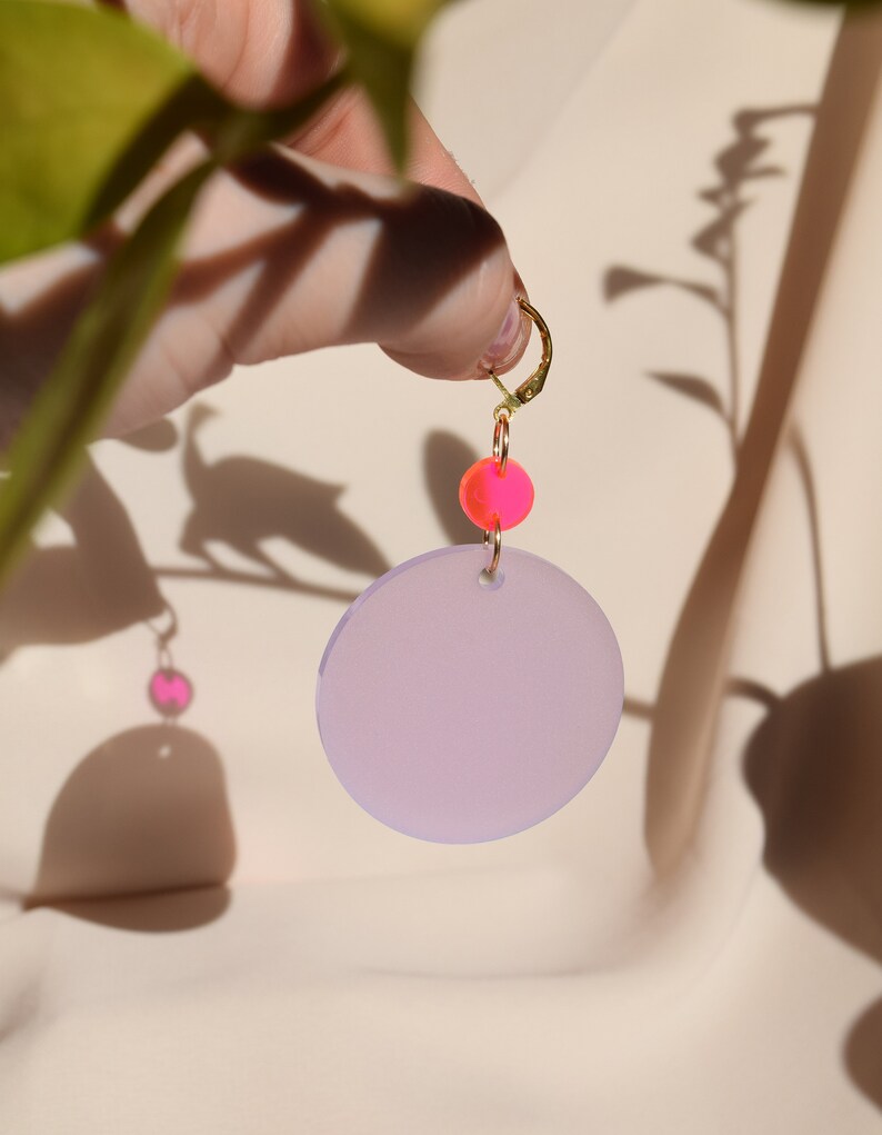 Neon pink and wisteria purple translucent acrylic circles