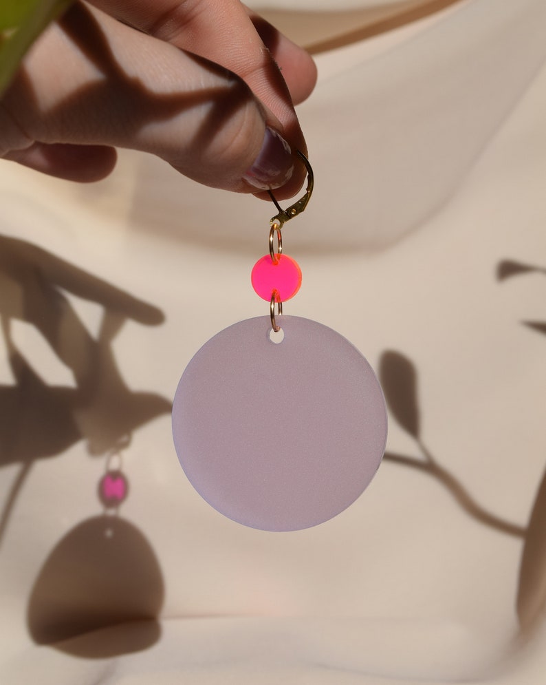 Neon pink and wisteria purple translucent acrylic circles