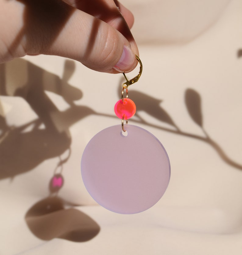 Neon pink and wisteria purple translucent acrylic circles