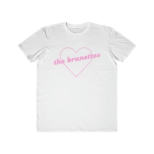 May include: White t-shirt with a pink outline of a heart that says "the brunettes" inside.