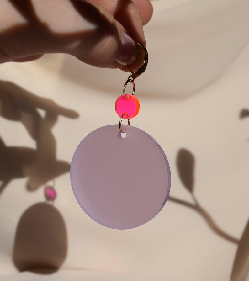 Neon pink and wisteria purple translucent acrylic circles