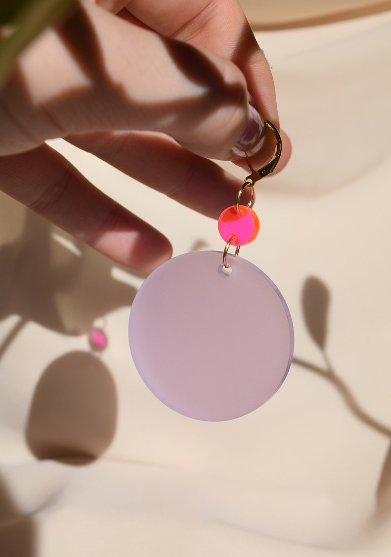 Neon pink and wisteria purple translucent acrylic circles