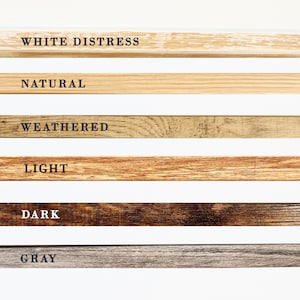 May include: Six wood samples showing different wood finishes: white distress, natural, weathered, light, dark, and gray.