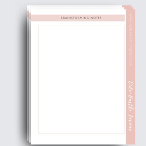 May include: A stack of blank white notepads with a pink header that says "Brainstorming Notes" and a pink side bar that says "Side-Hustle Income" and the website address "www.hustleandpurpose.nyc.com".